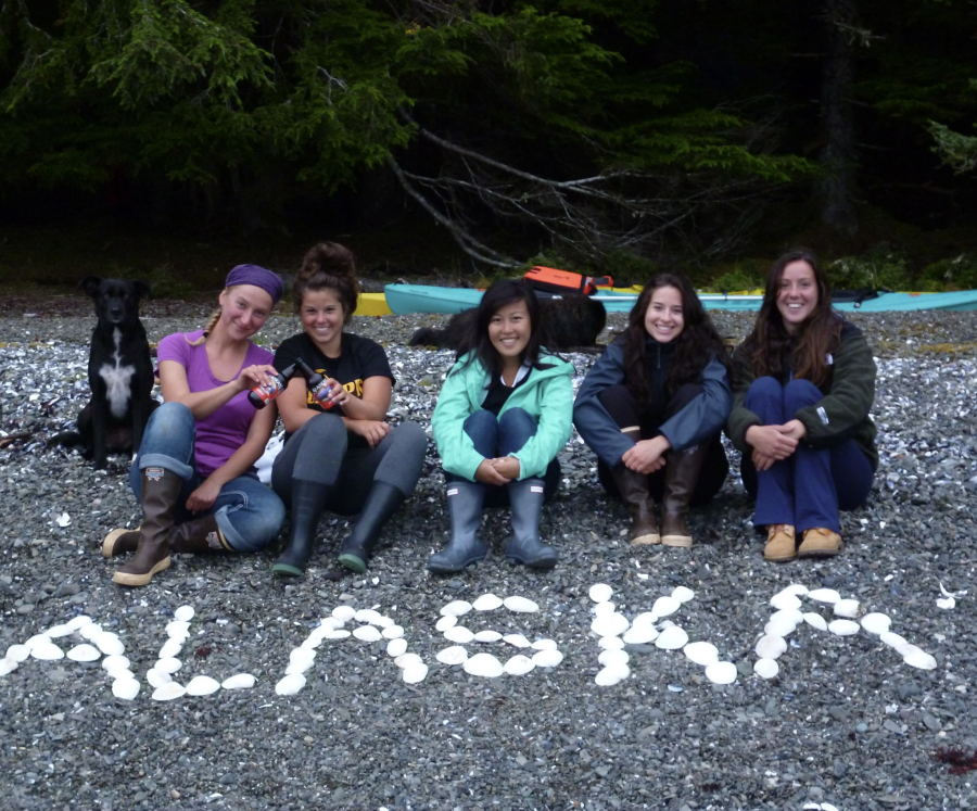A photograph of Michelle Fournet with fellow researchers at Five Finger Islands Lighthouse, Alaska