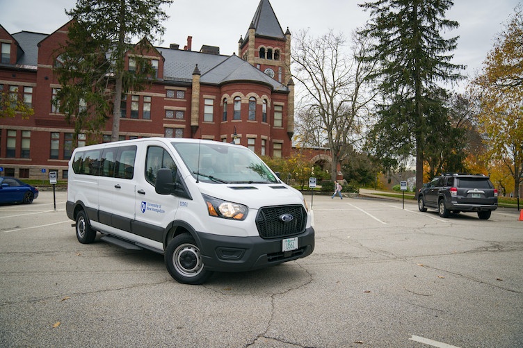UNH van parked outside of Thompson Hall