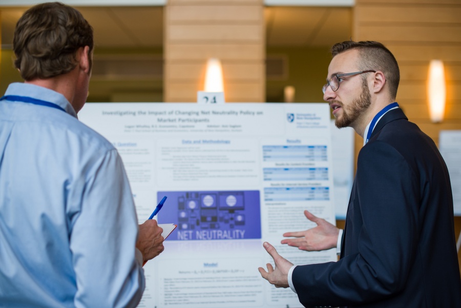 A University of New Hampshire student presenting research results during the 2018 Paul College of Business and Economics Undergraduate Research Conference