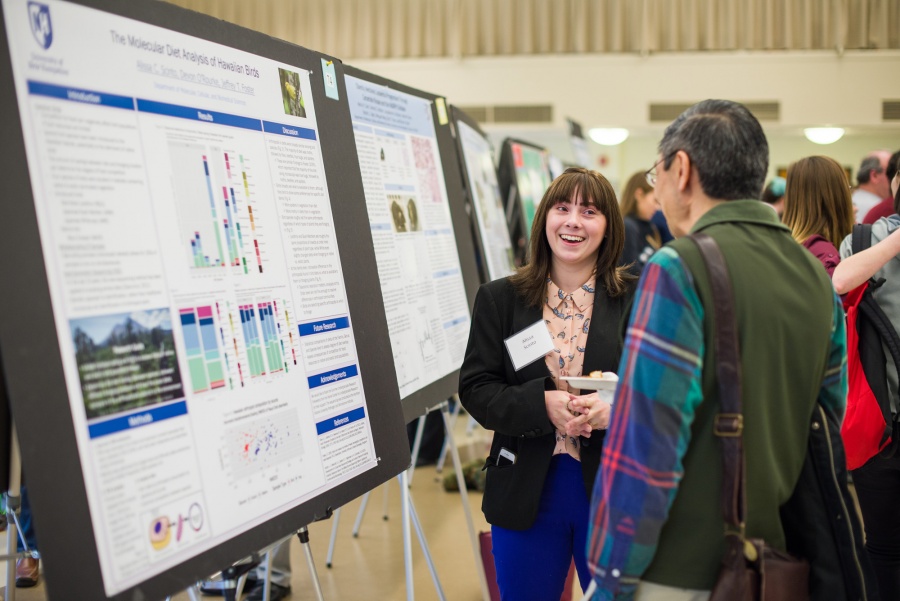 A UNH student presenting the results of her research during the UNH College of Life Sciences and Agriculture Undergraduate Research Conference 2018