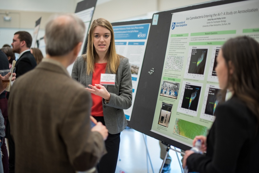 A student from the UNH College of Life Sciences and Agriculture presents her research poster during the 2018 Undergraduate Research Conference