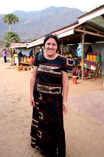 Erica Bertolotto dressed in traditional Tanzanian clothes at an onion market.