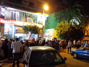 Egyptian women lining up to cast votes at 8 p.m. The men are lined up in the background.